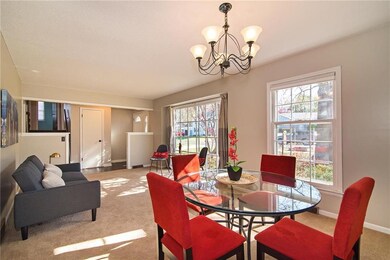 The living room is to your left, bathed in sunligh
