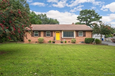 Ranch-style home with a front lawn