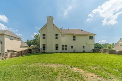 Rear view of property with a chimney