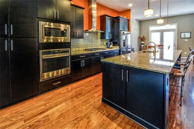 Wow! This gourmet kitchen features upgraded espres