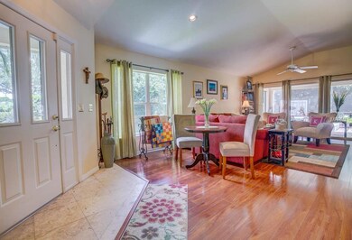 Enter into this warm living room with wood floors.
