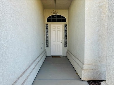 View of exterior entry with stucco siding