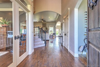 Wide entry with hand scraped wood floors and lots