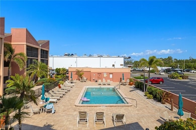 Community pool with a patio