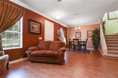 Elegant living in open floorplan with custom drape