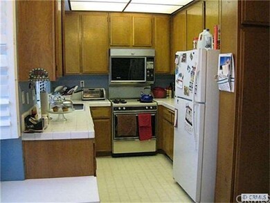 bright, sunny kitchen with loads of cabinet space 