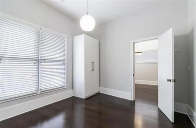 Spare room with dark hardwood / wood-style floors