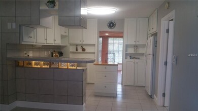 The breakfast bar and kitchen are in the middle of