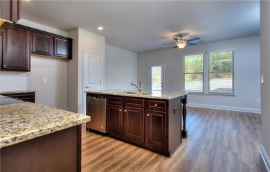 Kitchen with ceiling fan, a wealth of natural ligh