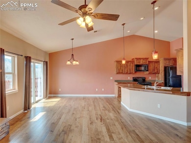 Custom hardwood floors through the entryway and ma