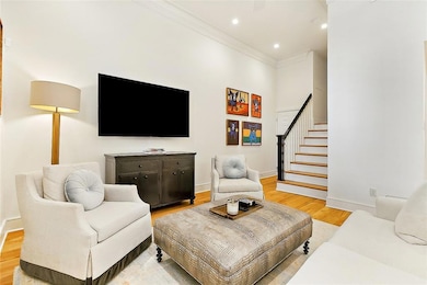 view of the living room, foyer and stairs leading