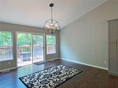 Large dining area with sliders to an upper deck wi