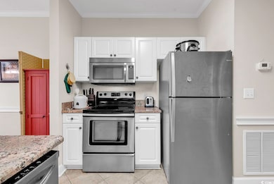 Kitchen with stainless steel appliances, white cab