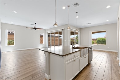 Kitchen featuring dishwasher, light wood finished