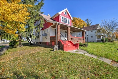 View of front of home with a porch and a front lawn