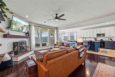 Spacious living room with updated fireplace and custom mantle.