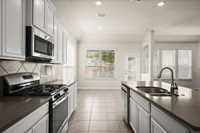 Kitchen featuring appliances with stainless steel