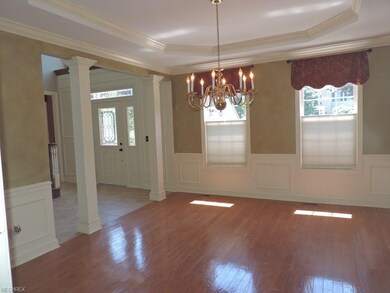 Crown molding and hardwood floors complete this ro