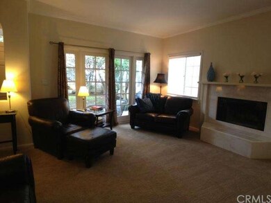 Living room w/ French doors to patio