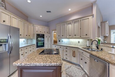 Tea stained  cabinetry with undermount lighting