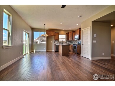 Living Room Opens Up To The Eat-In Kitchen