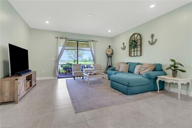 Living room with light tile patterned flooring