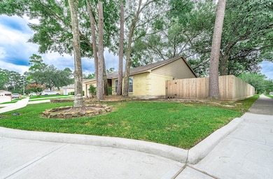 Nestled on a serene corner lot,
this charming hom