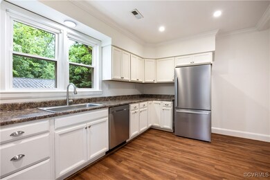 The kitchen also has ample storage space and white