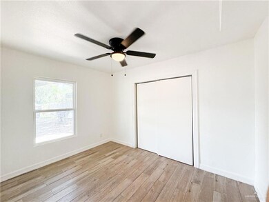 Unfurnished bedroom featuring light hardwood / wood-style floors, a closet, and ceiling fan