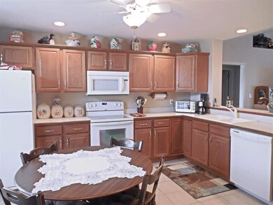 The spacious eat-in kitchen offers...
