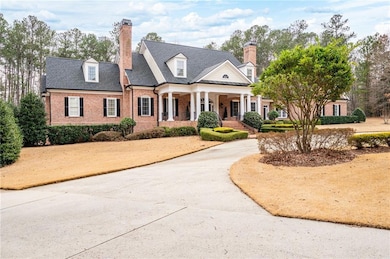 Left side driveway leads to additional 2 car