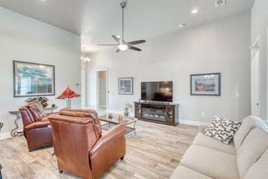 Living room with light wood-style floors, a ceili