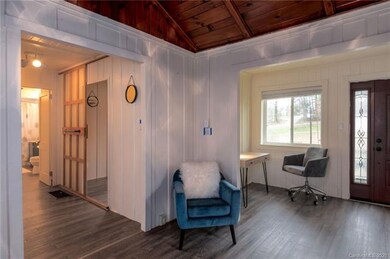 Entryway/office area opens to living room.