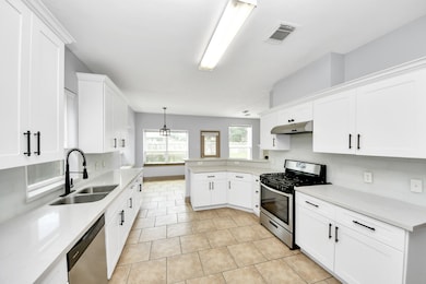 Bright white cabinetry offers a clean, timeless fr