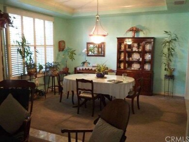 Formal dining room opens to formal living room
