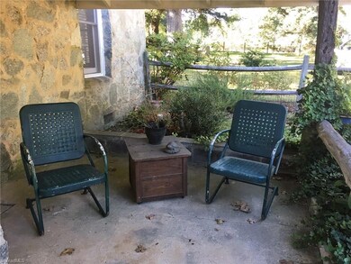Cover porch for enjoying the outdoors.