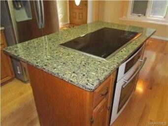 The work island has quartz counter top.