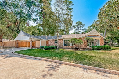 This is a single-story brick home with white trim,