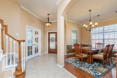 Lovely view of the formal dining room, front entry and the office.