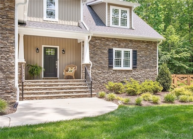 Property entrance featuring stone siding