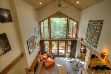 Large windows and voluminous vaulted ceilings make