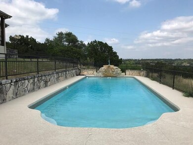 Gated iron fence around pool