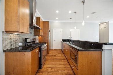Kitchen featuring granite countertops and hardwood