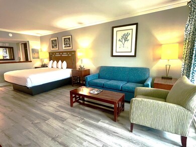 Bedroom featuring ornamental molding and wood-type flooring