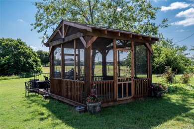 Screened in stand alone porch. Perfect for the eve
