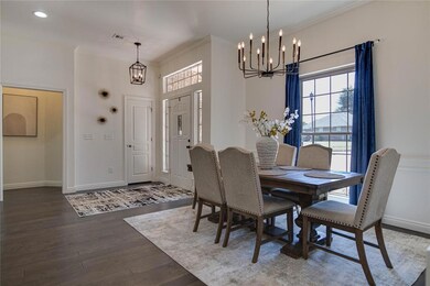 Formal dining area featuring an inviting chandelie