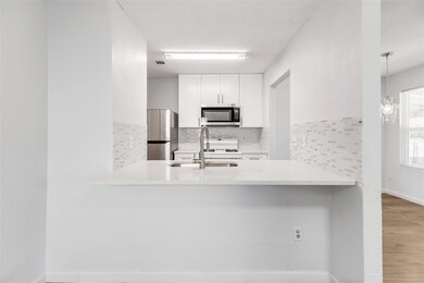 Kitchen featuring stainless steel appliances, a p