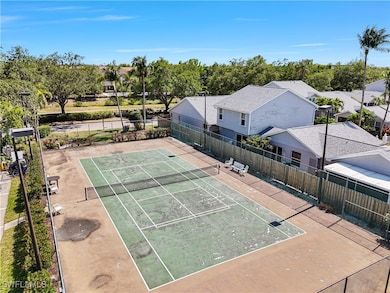 View of tennis court with fence