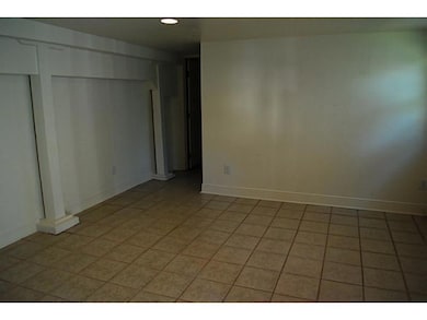 Living Room. Cozy apartment has recently been renovated- tile floors, neutral colors, wall units for a/c and heat.