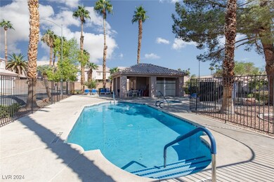 SPARKLING POOL WITH PALM TREES AND DESERT LANDSCAP